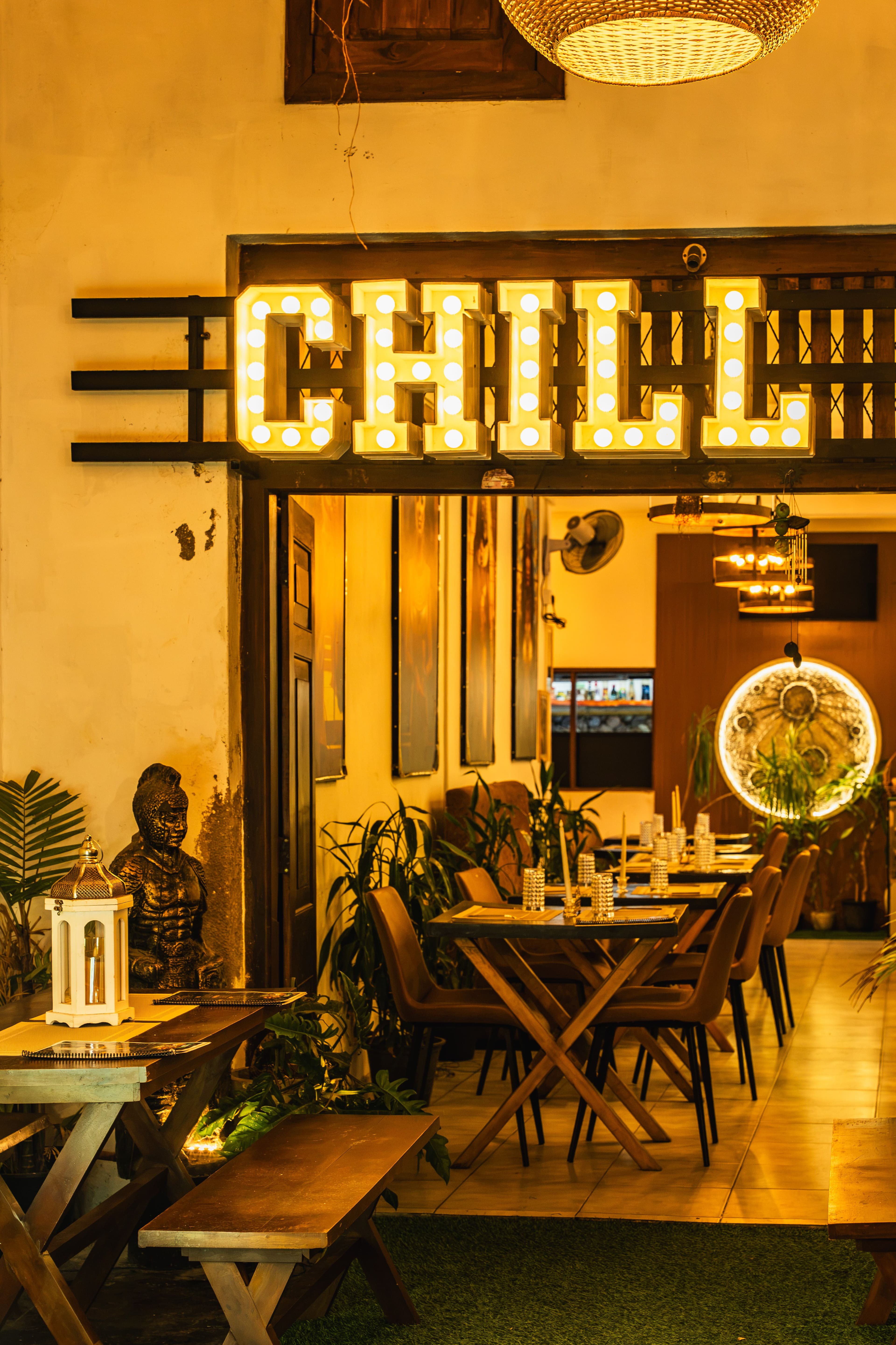 Illuminated ‘Chill’ marquee sign over a lounge entrance
