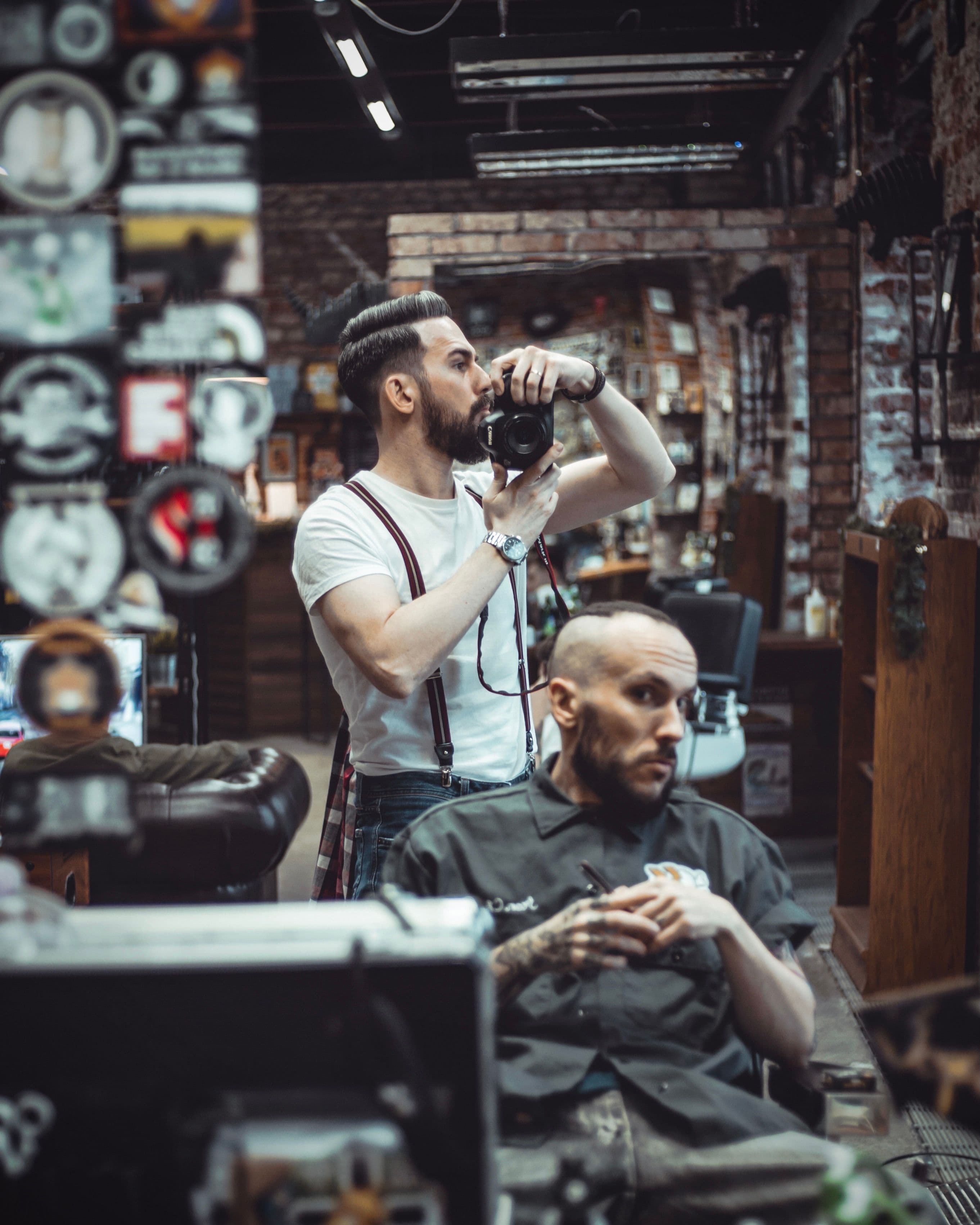 Candid moment inside a barbershop mid-cut