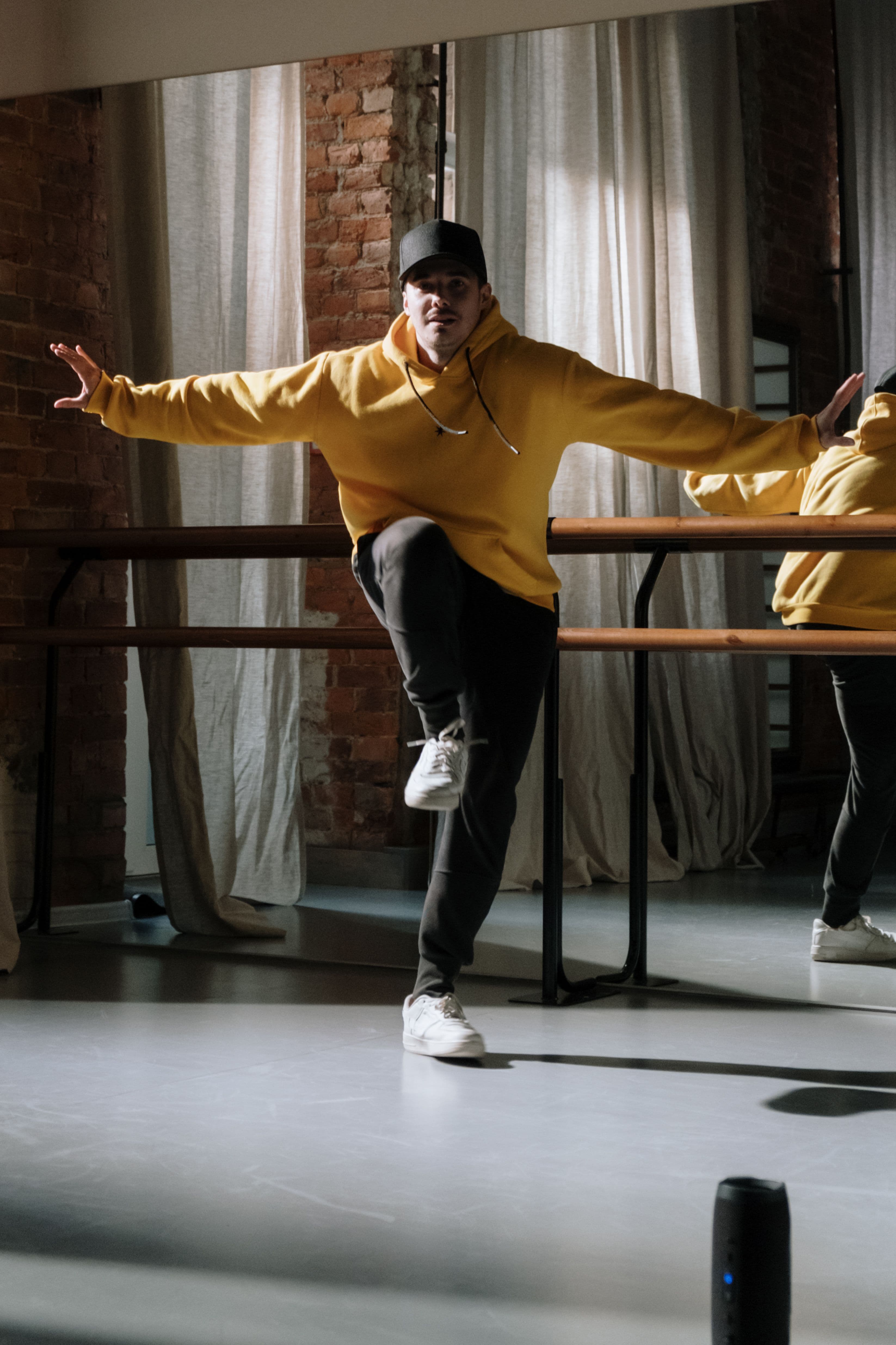 Dancers mid-movement in a studio class